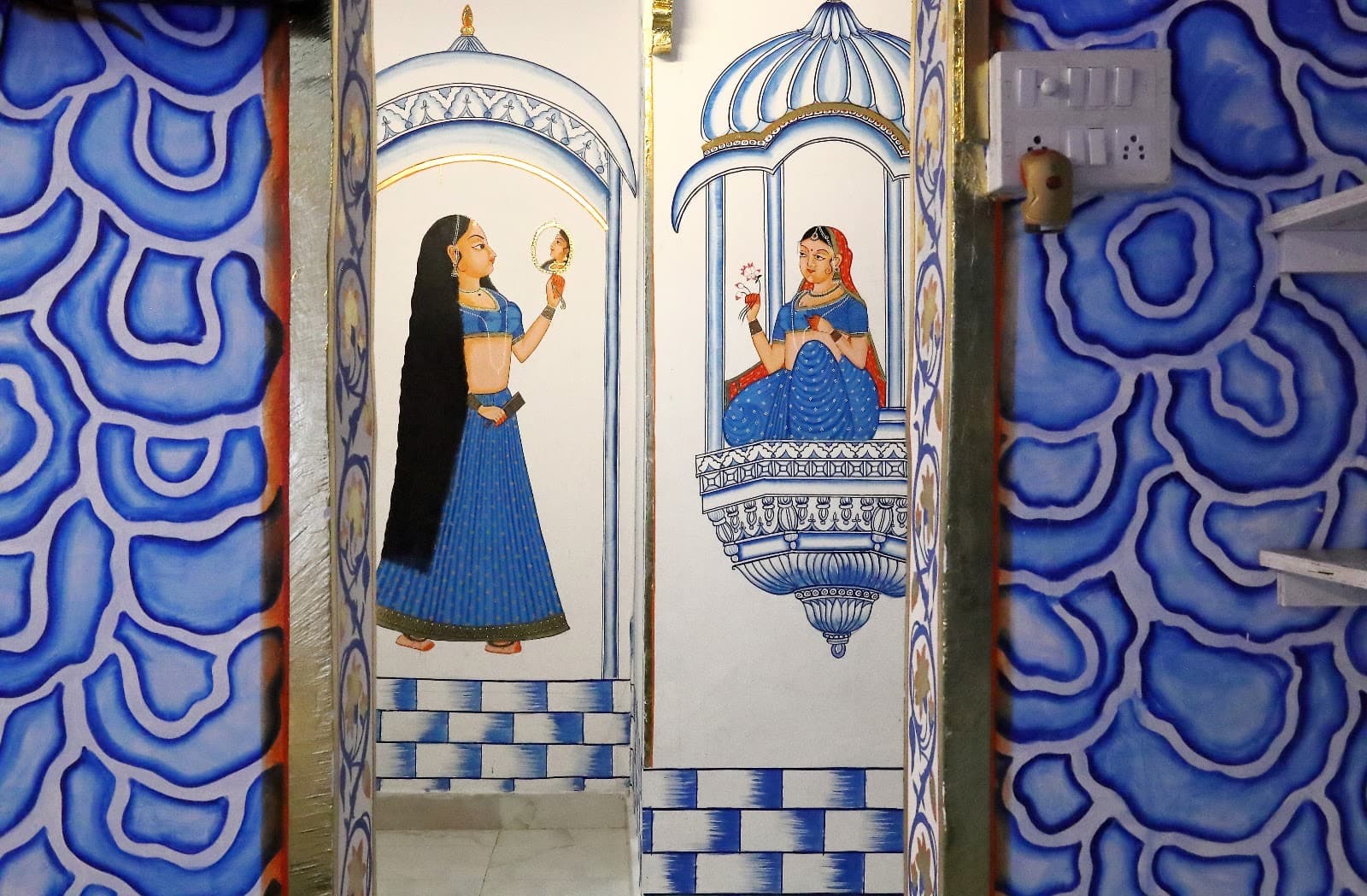 Hand-painted mural wall in Deluxe Room 101