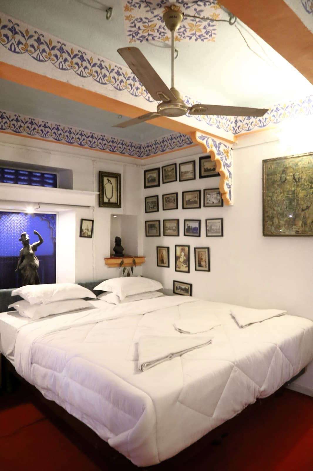 Deluxe Room 102 with framed art