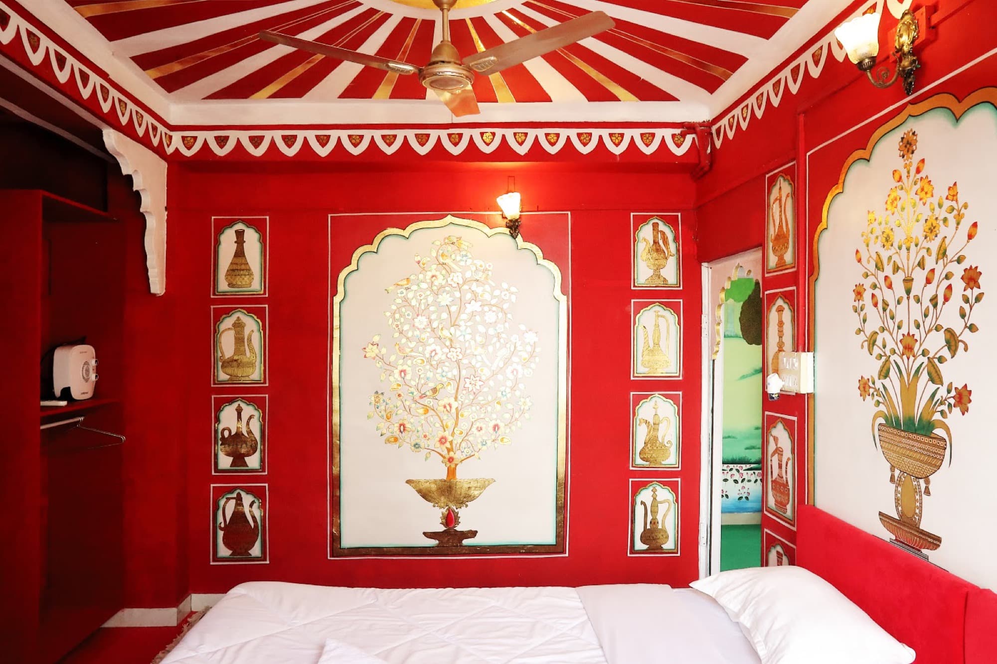Lake View Room 302 with a hand-painted tree mural and painted ceiling